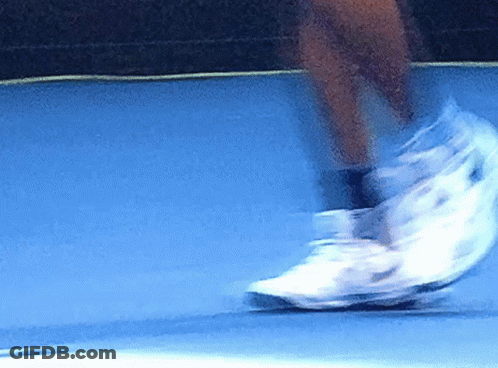Person Riding Skateboard Down Blue Ramp GIF
