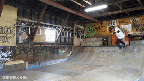 Person Riding Skateboard In Graffiti Room GIF