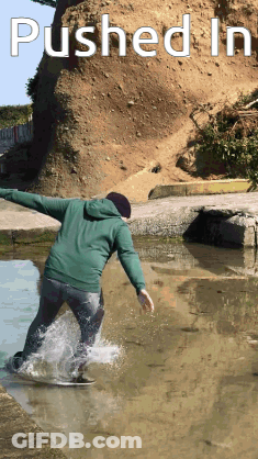 Person Riding Skateboard In Puddle GIF