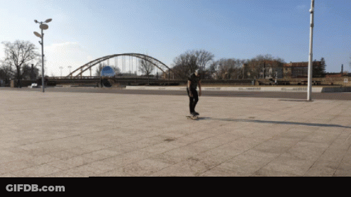 Person Riding Skateboard On Sidewalk GIF
