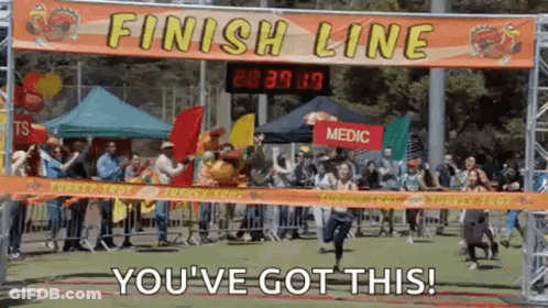 Person Running Across Finish Line At Turkey Trot GIF