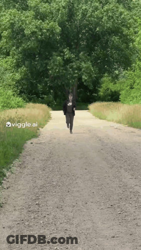 Person Running Down Dirt Road GIF