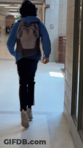 Person Running Down Hallway With Columbia Backpack GIF
