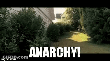 Person Running Down Path With Anarchy GIF
