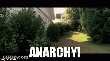 Person Running Down Path With Anarchy GIF