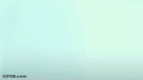 Person's Face Close Up Blue Background GIF