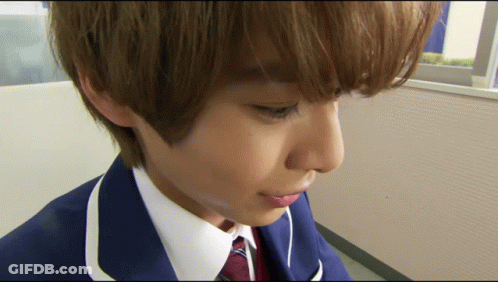 Person's Face Close Up In Blue Suit GIF