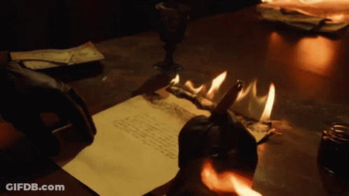 Person's Face In Dark With Light Shining Through GIF