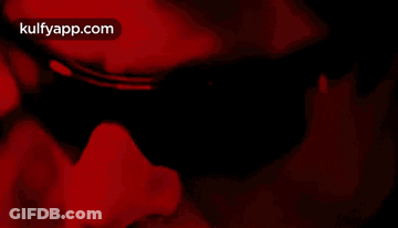 Person's Face In Red Light GIF