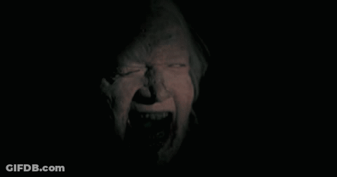Person's Face In The Dark GIF