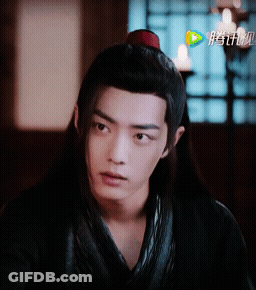 Person's Face With Chinese Writing GIF
