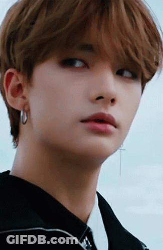 Person's Face With Cross Earring GIF