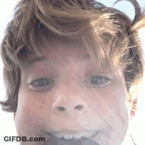 Person's Face With Slight Smile GIF