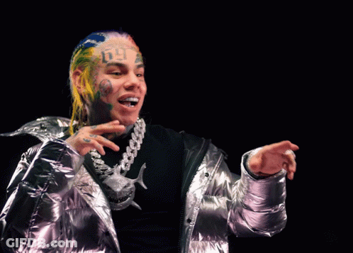 Person's Face With Tattoo Saying Six Nine GIF