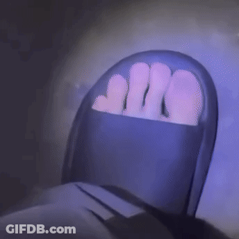 Person's Feet In Purple Chair GIF