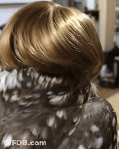 Person's Hair With Feathered Jacket GIF
