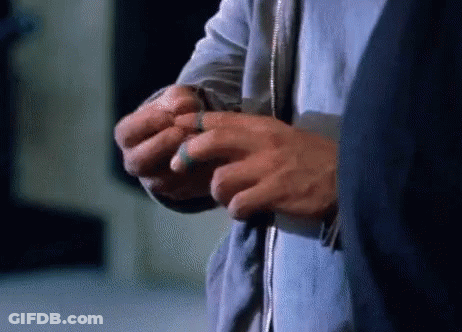 Person's Hands With Blue Ring GIF