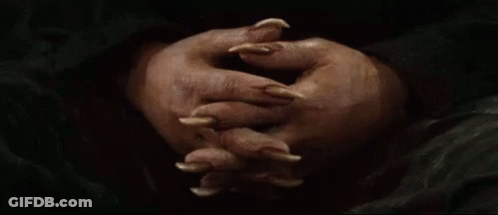 Person's Hands With Long Claws GIF