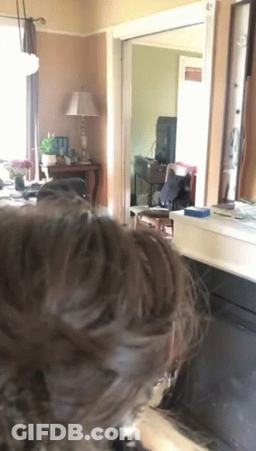 Person's Head In Living Room With Lamp GIF