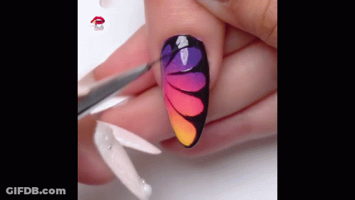 Person's Nails With Colorful Design GIF