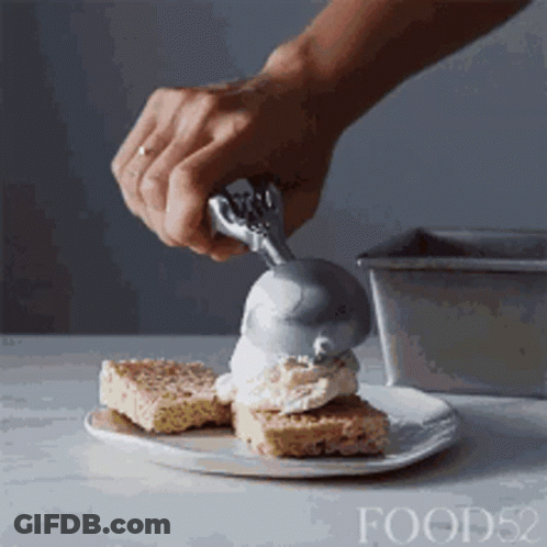 Person Scooping Ice Cream On Cake GIF