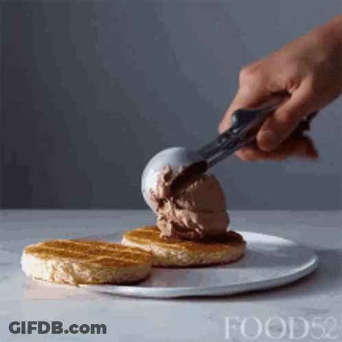 Person Scooping Ice Cream Onto Waffle GIF