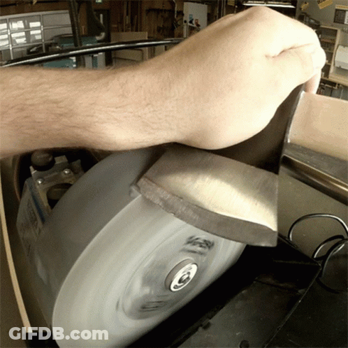 Person Sharpening Knife On Machine Saying Sharpen GIF