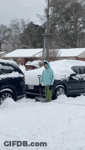 Person Shoveling Snow In Front Of Texas Car GIF