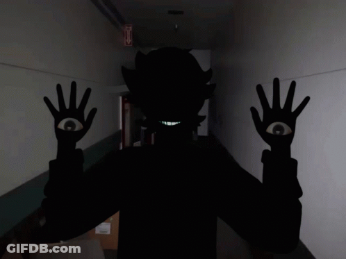 Person Silhouette With One Eye And Fire Exit Sign GIF