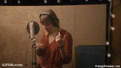 Person Singing Into Microphone GIF