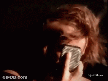Person Singing Into Microphone Close Up GIF