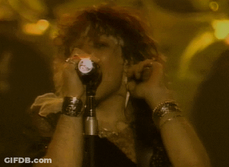 Person Singing Into Microphone With Flashlight GIF
