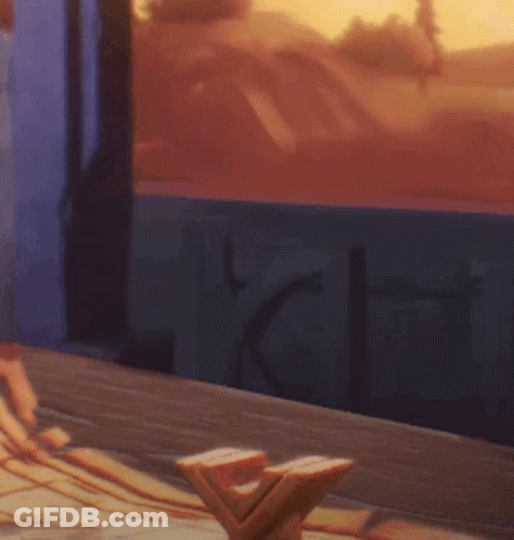 Person Sitting At Table By Window With Sunset GIF