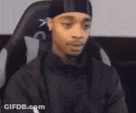 Person Sitting In Chair With Crossed Arms Making A Funny Face GIF