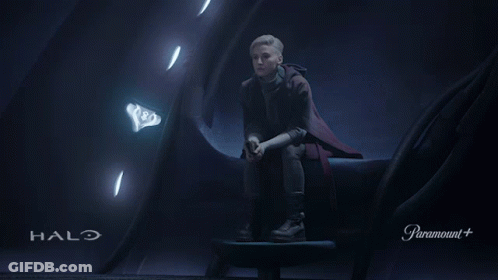 Person Sitting In Dark Room With Halo GIF