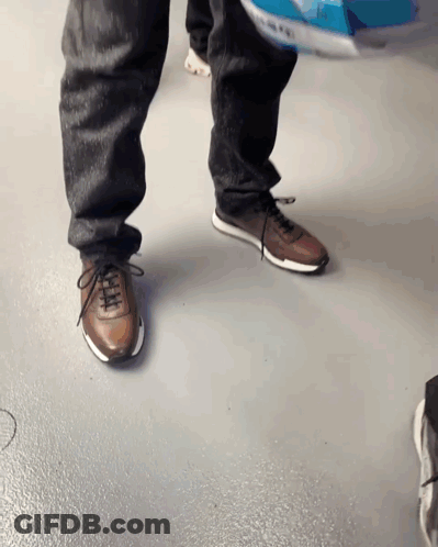 Person Sitting On Bench Holding Phone And Sunglasses GIF