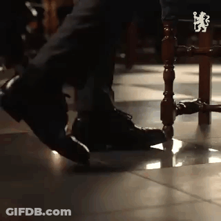Person Sitting On Chair With Foot On Leg GIF