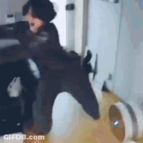 Person Sitting On Chair With Vacuum Cleaner GIF