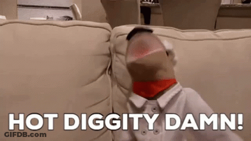 Person Sitting On Couch With Sock In Mouth Saying Hot Diggity Damn GIF