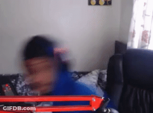 Person Sitting On Couch GIF