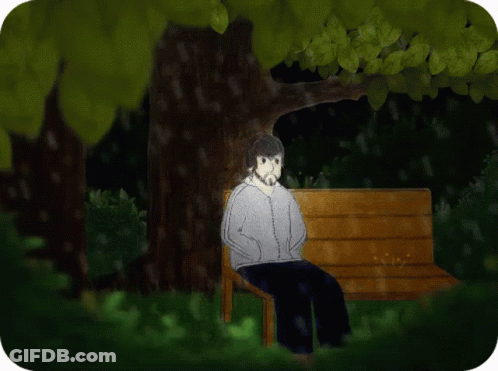 Person Sitting On Park Bench Under Tree GIF