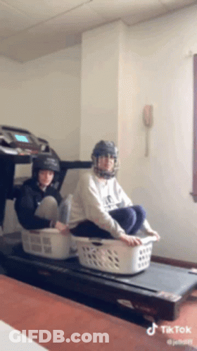 Person Sitting On Treadmill With Laundry Basket GIF