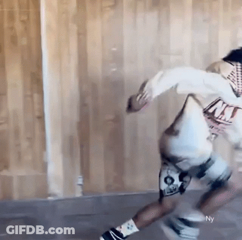 Person Skateboarding In Room With Wooden Wall GIF