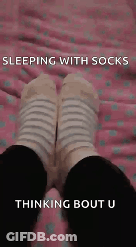 Person Sleeping With Socks Thinking About You GIF