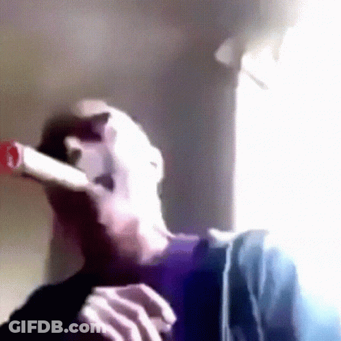 Person Smoking Cigarette By Window GIF