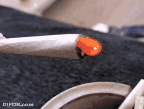 Person Smoking Cigarette With Orange Flame GIF