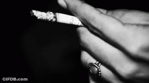 Person Smoking Cigarette With Ring GIF
