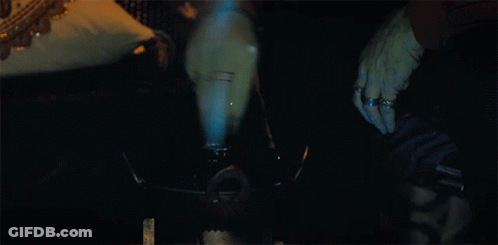 Person Smoking Hookah With Blue Smoke GIF