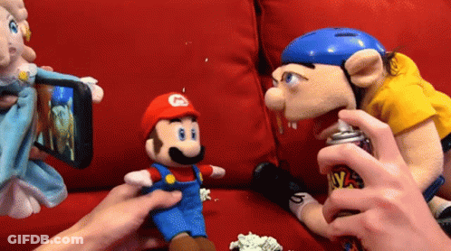 Person Spray Painting Stuffed Mario GIF