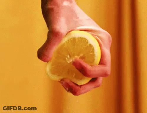 Person Squeezing Lemon GIF